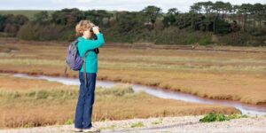 A-person-bird-watching-and-connecting-actively-to-nature